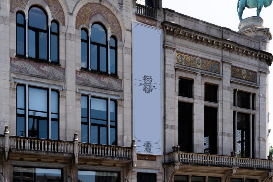 Vertical banner mockup on ornate stone building facade with arched windows